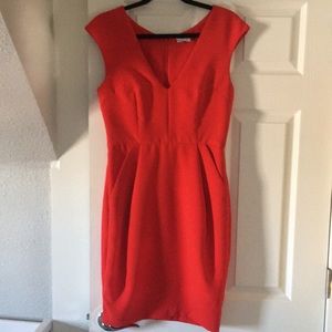 Bright red sheath dress with pockets.